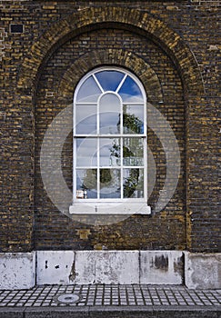 Arched warehouse window photo