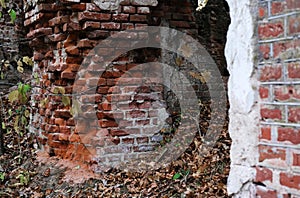 Arched window openings of a destroyed abandoned building. Broken vintage arches of a ruined abandoned ancient building