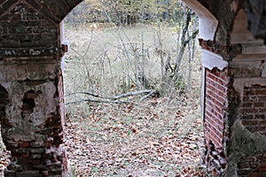 Arched window openings of a destroyed abandoned building. Broken vintage arches of a ruined abandoned ancient building