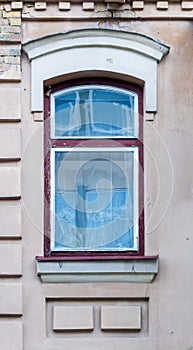 Arched window in plastered wall