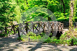 Arched wooden bridge in Sofiyivka park in Uman, Ukraine