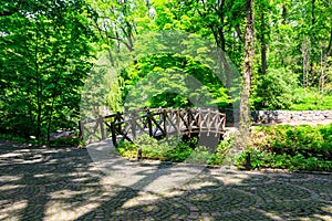 Arched wooden bridge in Sofiyivka park in Uman, Ukraine