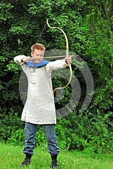 Archer aiming bow photo
