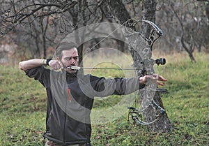 Archer shooting compound bow