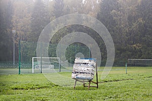 Archer target alone on green field. photo
