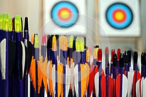 Archery arrows with targets in out of focus background