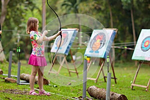 Archery for child. Kids shoot a bow. Arrow, target