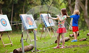 Archery for child. Kids shoot a bow. Arrow, target photo