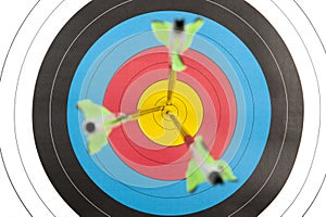 Archery target with arrows in short dept of field photo