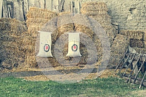 Archery target on the background of haystacks