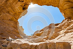 The Arches, amazing round hole in the rock, closed arch in ancient cooper mines canyons and mountains range in Timna National Park