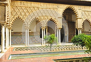 Arches of the Courtyard of the Maidens -Patio de las Doncellas- in the Real Alcazar Palace of Seville, Spain.