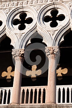 Arches of doge's palace with sunlight reflection photo