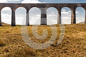 Arches of a graceful railway viaduct, telephoto