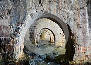 Arches inside ancient shipyard of Alanya. Turkey, Asia