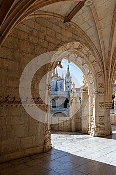Arches of Jeronimos Monastery Gallery, Belem, Lisbon, Portugal photo