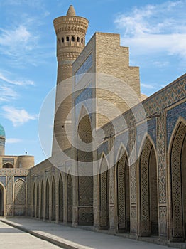 Arches and a minaret. photo