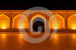 Arches of night view with light effect of Allahverdi Khan Bridge, also named  Si-o-seh pol bridge across the Zayanderud river in