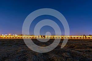 Arches of night view with light effect of Allahverdi Khan Bridge, also named  Si-o-seh pol bridge across the Zayanderud river in