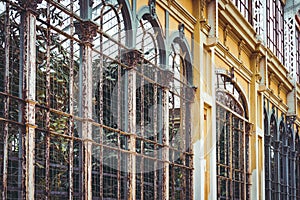 Arches of an old rusty greenhouse