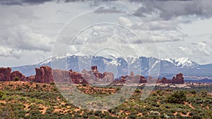 Arches panorama and snowcapped mountains in the background