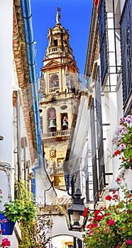 Flower Street Calleja de las Flores Old Torre del Alminar Bell Tower Mezquita Cordoba Andalusia Spain. photo