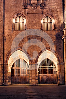 Arches windows and gates of medieval building in Bologna Italy