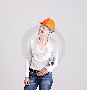 Archictress in Safety Helmet is Holding a Building Plans