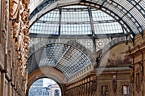 The arching glass and cast iron roof of Galleria Vittorio Emanuele II in Milan, Italy.