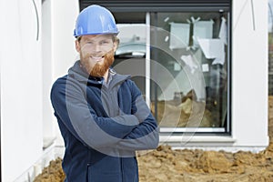 Architect with blue helmet at work photo