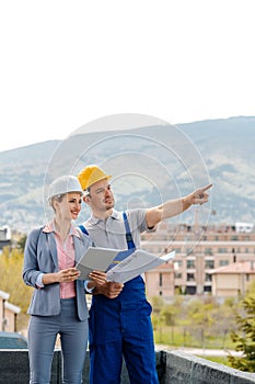 Architect and builder developing ideas for construction project