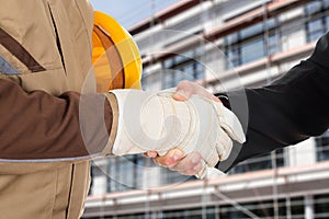 Architect and businessman shaking hands