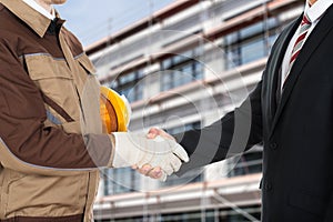 Architect and businessman shaking hands