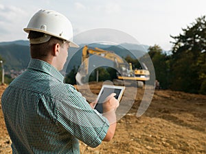 Architect checking plan on tablet