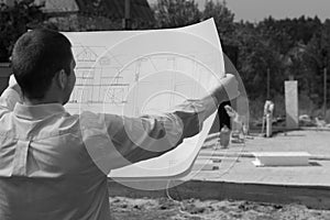 Architect checking the progress of a new build