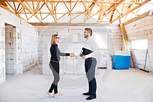 Architect and civil engineer at the construction site.