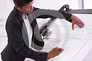 Architect, civil engineering or black woman drawing on blueprint or paper model for development project. Measure