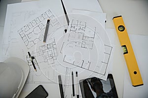 architect design working drawing sketch plans blueprints and making architectural construction model in architect studio