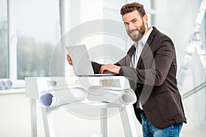 Architect or designer working with laptop