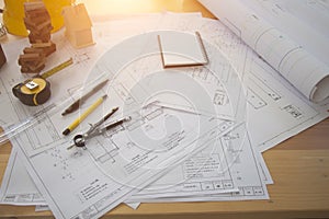 Architect desk ,Business,engineering concept,construction site, soft focus, vintage tone, working with blueprints in the office.