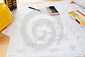 Architect desk ,Business,engineering concept,construction site, soft focus, vintage tone, working with blueprints in the office.