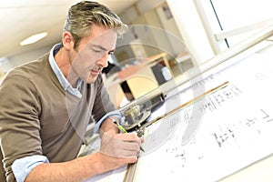 Architect drawing a construction plan