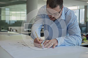 Architect drawing lines on CAD Drawings