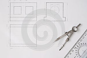 Architect drawing on paper with compass and ruler