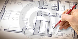Architect drawing a planimetry of a residential building
