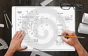 Architect drawing project of business facility on work desk