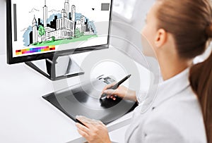 Architect with drawing tablet in office