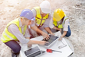 Architect engineer and builder team working together meeting planning at construction site for installation solar panel in