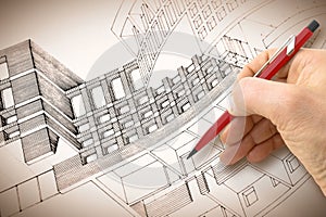 Architect or engineer designing a sketch of a new residential building in a new modern town