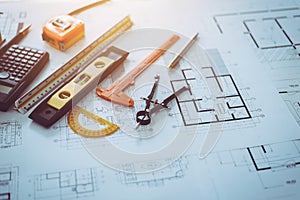 Architect engineer drawing plan object put on table desk